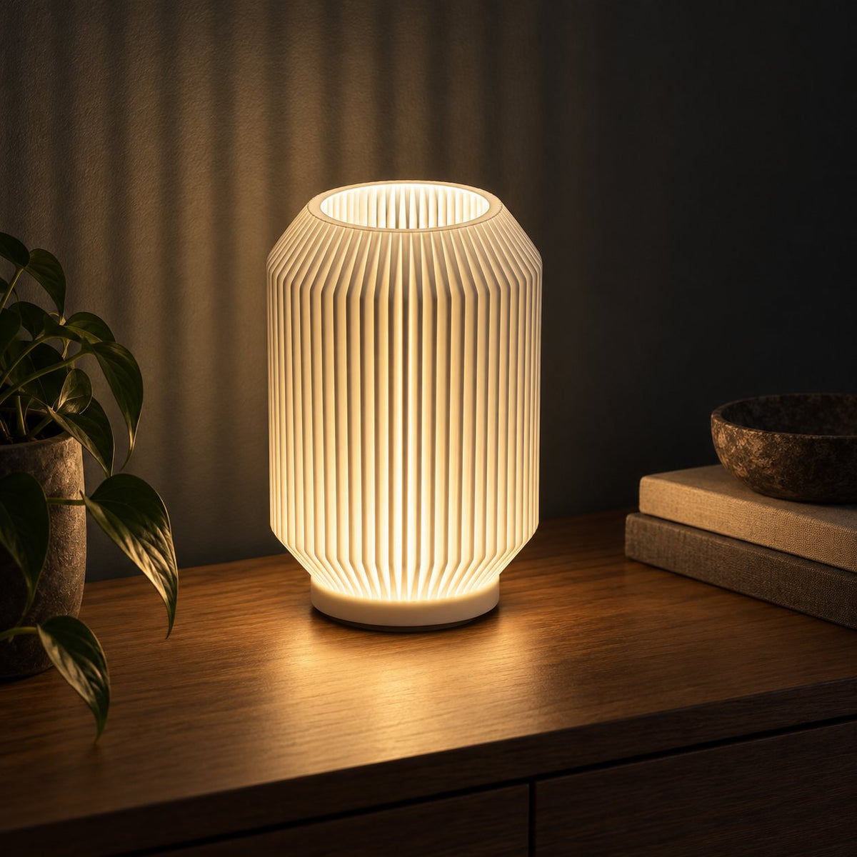 Ribelle Glow 3D printed table lamp (15 cm) glowing warmly at night