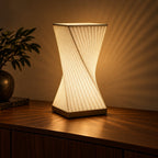 Twistora 3D printed table lamp (18 cm) glowing warmly at night